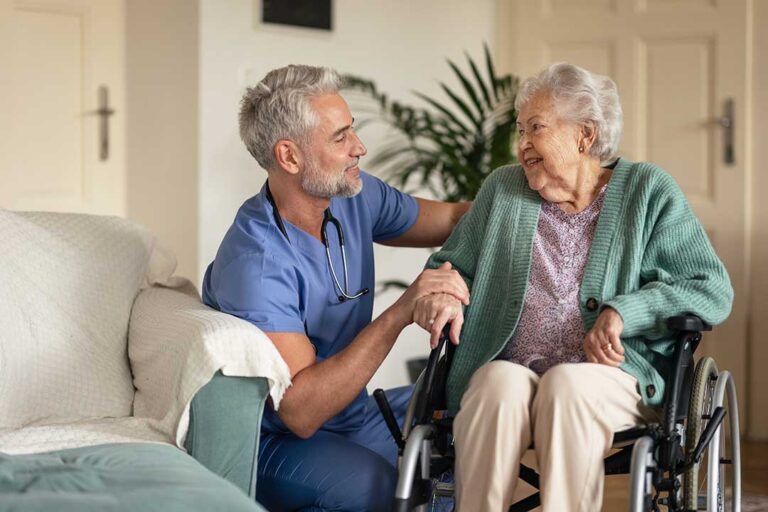 Family reviews an assisted living contract and fee schedule at a kitchen table with a calculator and pen.